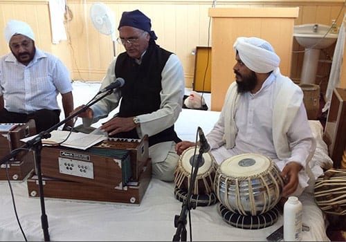 Getting ready to sing religious hymns at the Sikh Temple in Bristol